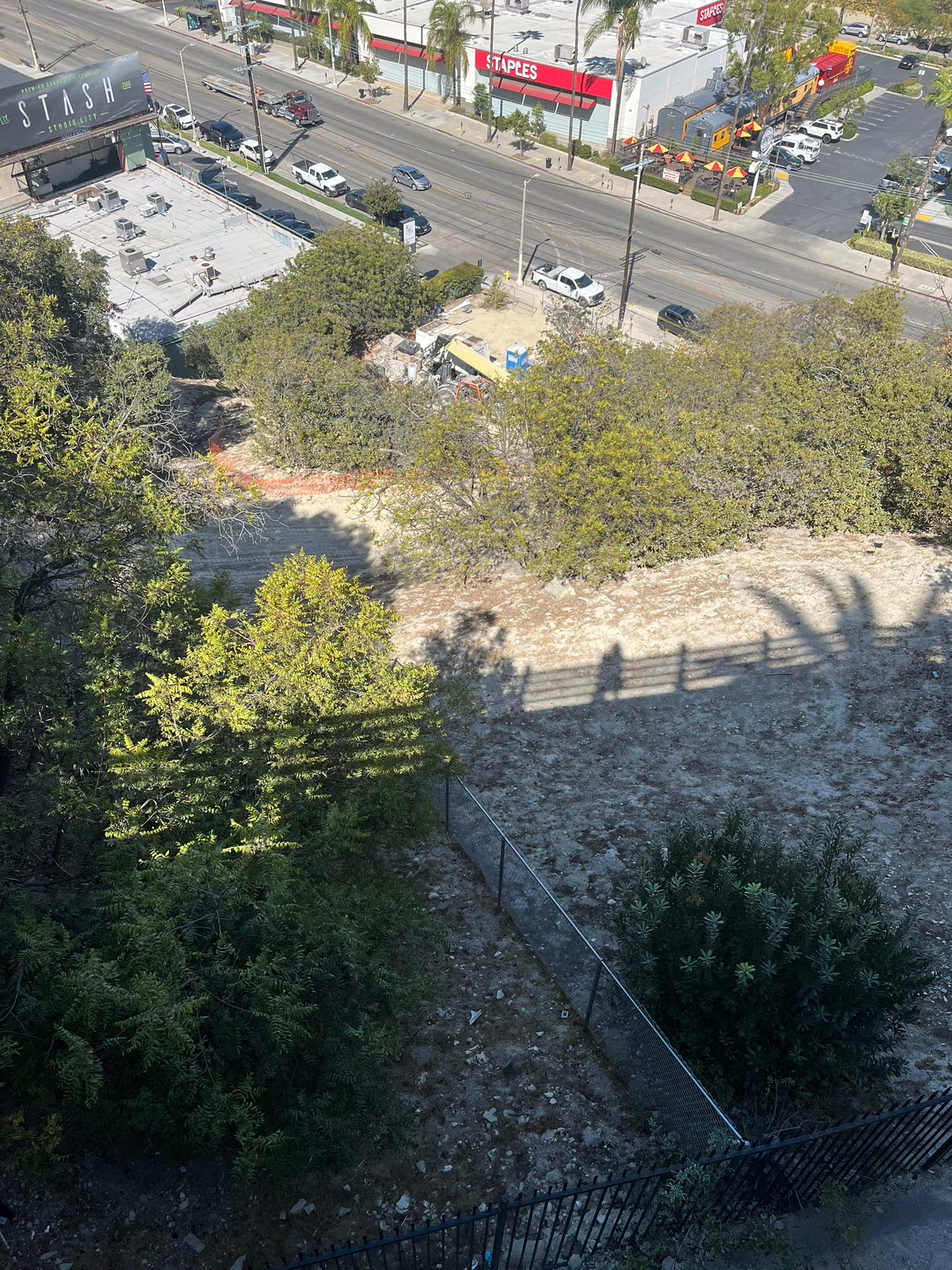 Overhead view of exposed ground and work activity at the Sunswept Place site.